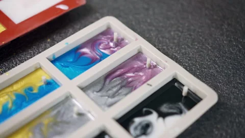 Silicone molds of small rectangular shape filled with different epoxy resin Stockbeeldmateriaal 263191647