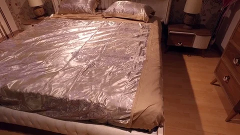 Silk bedding on the bed Stock Footage 79243644