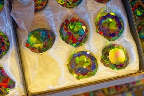 Silk box with large decorative crystals reflecting rainbow colors. Stock Photos