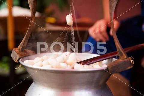 Silk Cocoons Boiling In Large Pot Stock Photos
