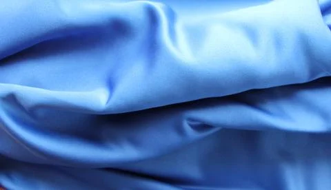 Silk drape blue silk in large folds Stock Photos