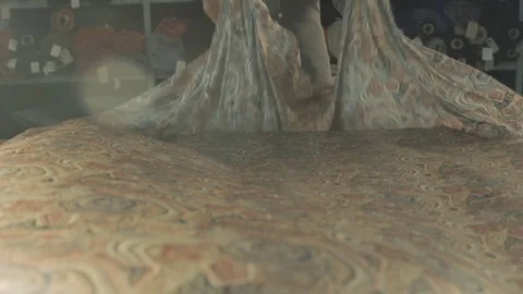 Silk fabric develops beautifully. Female in the workshop. Slow motion Video stock 73290912