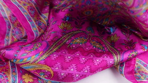 A silk scarf with colorful paisley patterns gently. Stock Footage 337404598