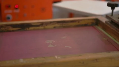 Silk Screen printing manufacturing on t-shirts print Stock Footage 76842627