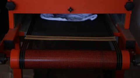 Silk Screen printing manufacturing on t-shirts print Stock Footage 76843602