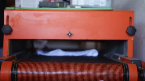 Silk Screen printing manufacturing on t-shirts print Stock Footage 76843640