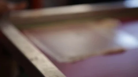 Silk Screen printing manufacturing on t-shirts print Stock Footage 76843937