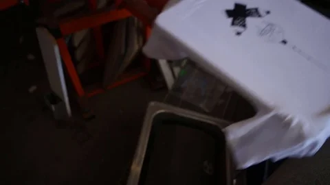 Silk Screen printing manufacturing on t-shirts print Stock Footage 76843990
