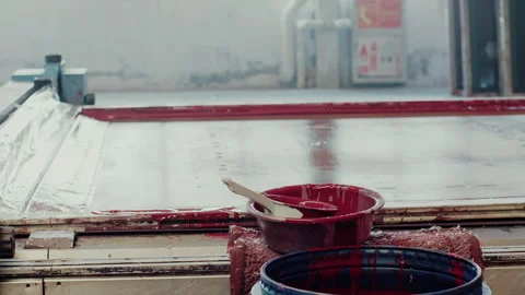 Silk screen printing process using red ink in a workshop Stock Footage 333209965