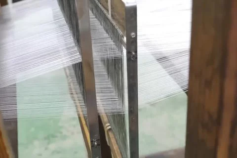 Silk, threads stretched across the loom. Stock Photos