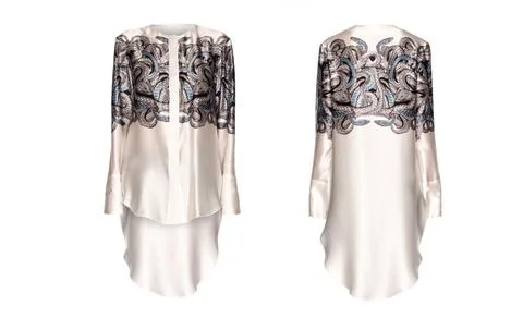 Silk white tunic with a pattern on a white background Foto stock