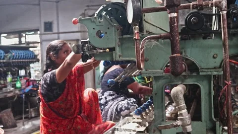 Silk worker boiling silkworm cocoons for thread extraction in a traditional 库存影片 340412066