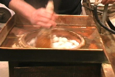 Silkworm floating in hot water Stock Footage 110503