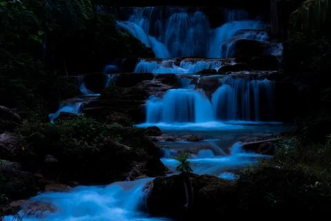 Silky Blue Water Cascades Flowing Down Multi Tiered Limestone Rocks At Huai.. 写真素材