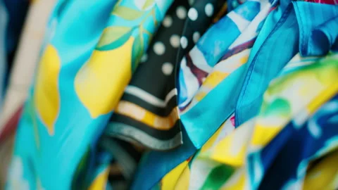 Silky lemon patterned scarves folded in bright blue and yellow in Amalfi Stock Footage 344735191