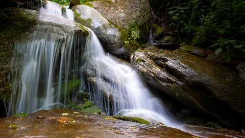 Silky water forms hidden waterfall serenity in  North Carolina, USA. Stock Photos