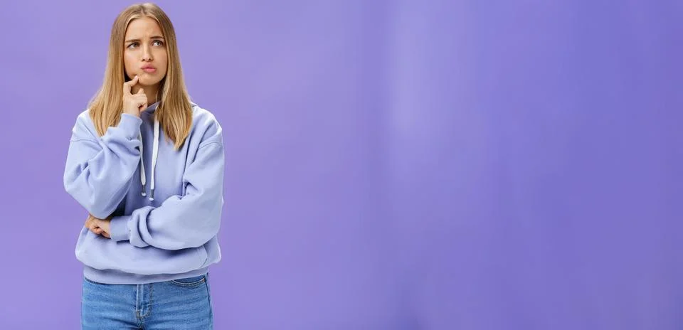 Silly concerned girlfriend trying think up how solve problem standing thoughtful Stock Photos