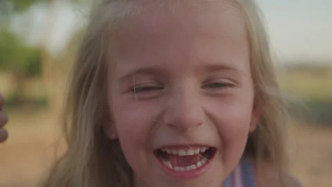 Silly Little Girl Laughing Outside | Stock Video | Pond5