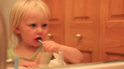 Silly two year old messes up lipstick Stock Footage 41651536