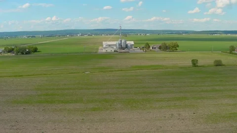 Silo and crops fields in a rural area of Canada. Video stock 157463116