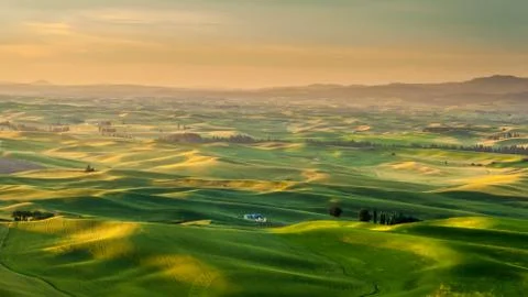 Silo in beautiful rolling crop fields landscape of Palouse during sunrise Stock Photos