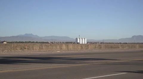 Silo on desert farm with mountain in view 02 Video stock 44342418