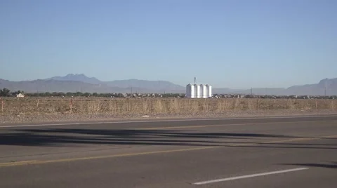Silo on desert farm with mountain in view 03 Stock Footage 44342445