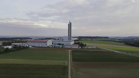 Silo tower at cloudy evening approaching &amp; ascending aerial time-lapse Stock Footage 172186982