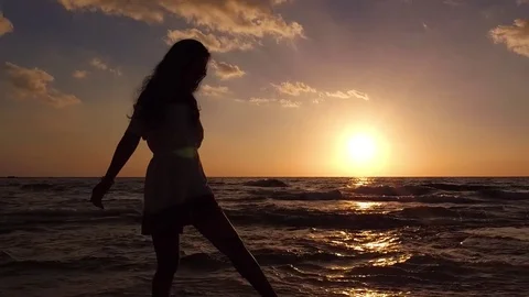 Silohette Lady Enjoying Ocean Sunset Stock Footage 82150438