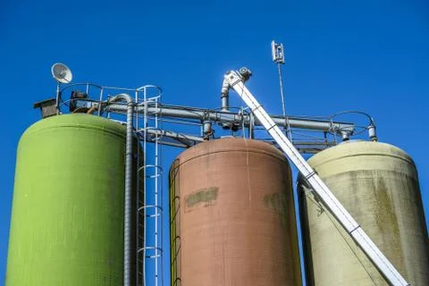 Silos on blue background Stock Photos