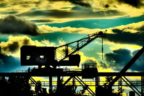 Siloutte of an old ship crane Stock Photos