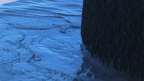 Silted lapping waves hitting a dock post on the river Humber. Hull, UK Video stock 103290511