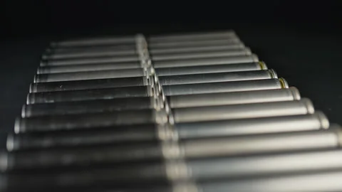Silver AA batteries type on black matte background. Standard size single ce.. Stock Footage 331678129