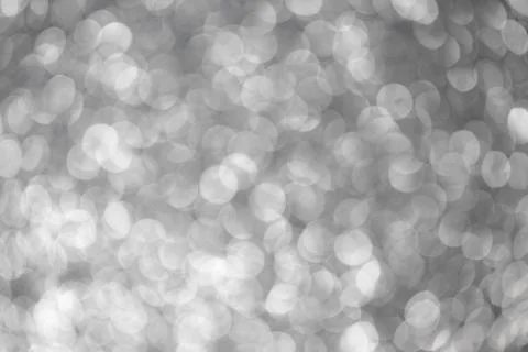 Silver abstract bokeh background. Silver Christmas texture. Stock Photos