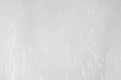 Silver abstract texture with falling sparkles . Stock Photos