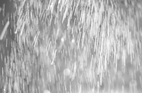 Silver abstract texture with falling sparkles . Stock Photos