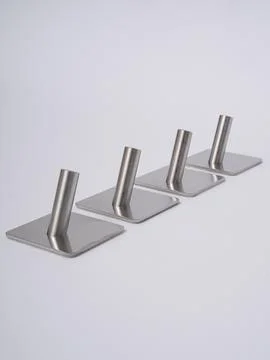 Silver adhesive wall hooks diagonal Stock Photos