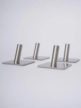 Silver adhesive wall hooks row Stock Photos