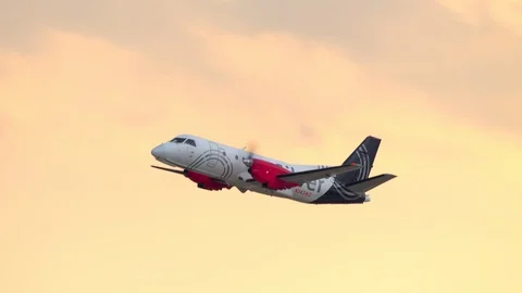 Silver Airways Taking Off into an Orange Sky from Ft. Lauderdale Stock Footage 109588401