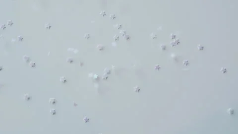Silver and blue stars fall on white background. Stock Footage 260392995