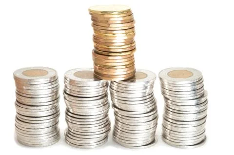 Silver and brass coins stack on white background Stock-Fotos