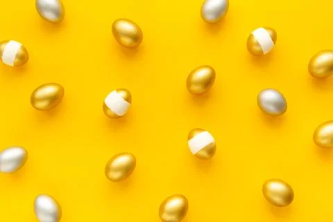 Silver and golden Easter eggs. Easter decoration, top view Stock Photos