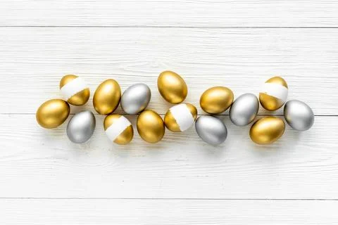 Silver and golden Easter eggs. Easter decoration, top view Stock Photos