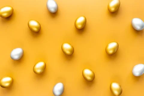 Silver and golden Easter eggs. Easter decoration, top view Stock Photos