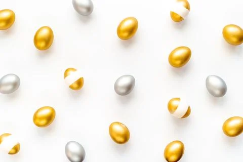 Silver and golden Easter eggs. Easter decoration, top view Stock Photos