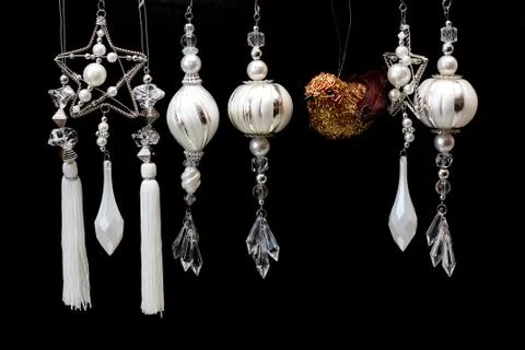 Silver and white christmas tree ornaments on black Stock Photos