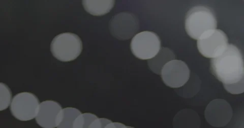 Silver and White shining lights race across the frame in a computerized Video stock 97257092