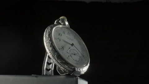 Silver antique pocket watch on a stand Stock Video Pond5