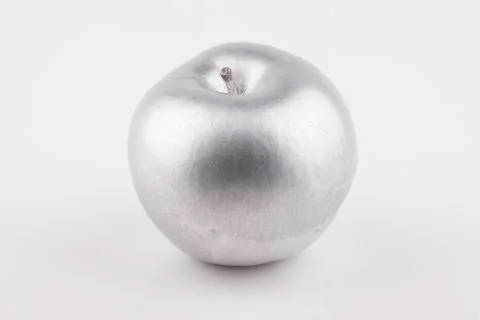 Silver Apple on white background closeup Stock Photos