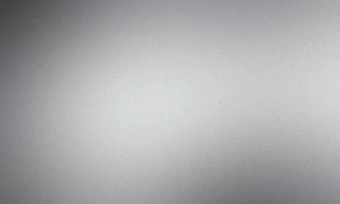 Silver background with a grainy texture and a gradient getting darker on t... Stock Photos